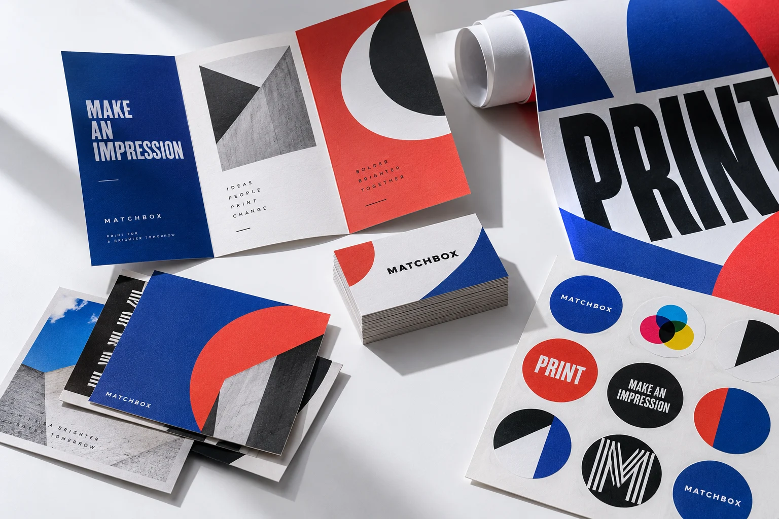 Business cards, colorful brochures, postcards and stickers arranged in the Matchbox colors